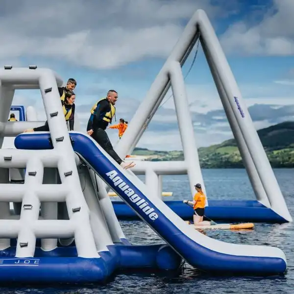13. Jungle Joe, Conquer our towering climbing frame featuring a slide. These safe pyramid style walls offer a climbing challenge for all ages, making it the perfect experience for everyone. West Lake Aqua Park